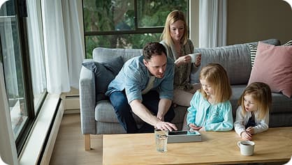 Family sitting together on sofa
